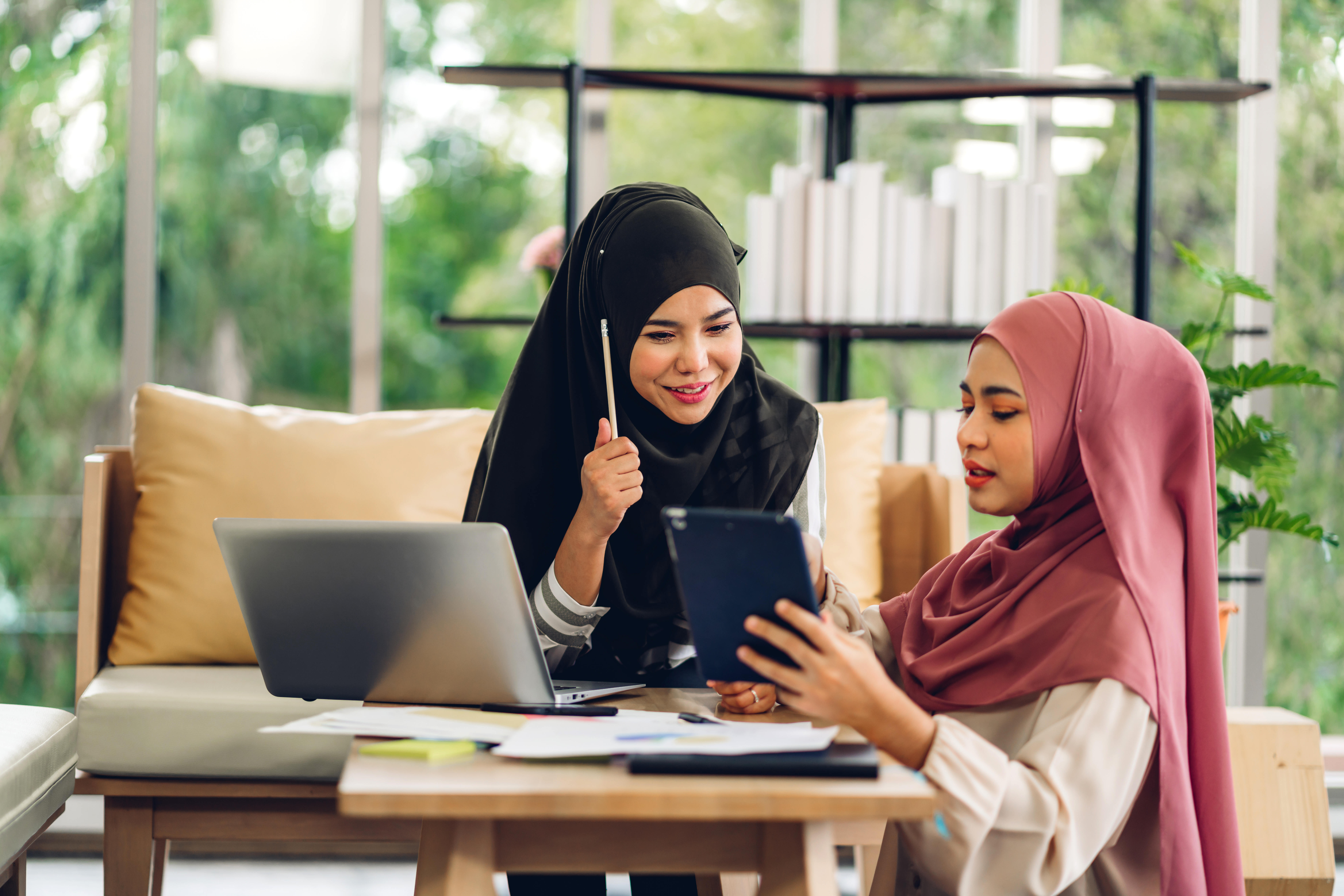 Young,Two,Smiling,Happy,Beautiful,Asian,Muslim,Woman,Relaxing,Using